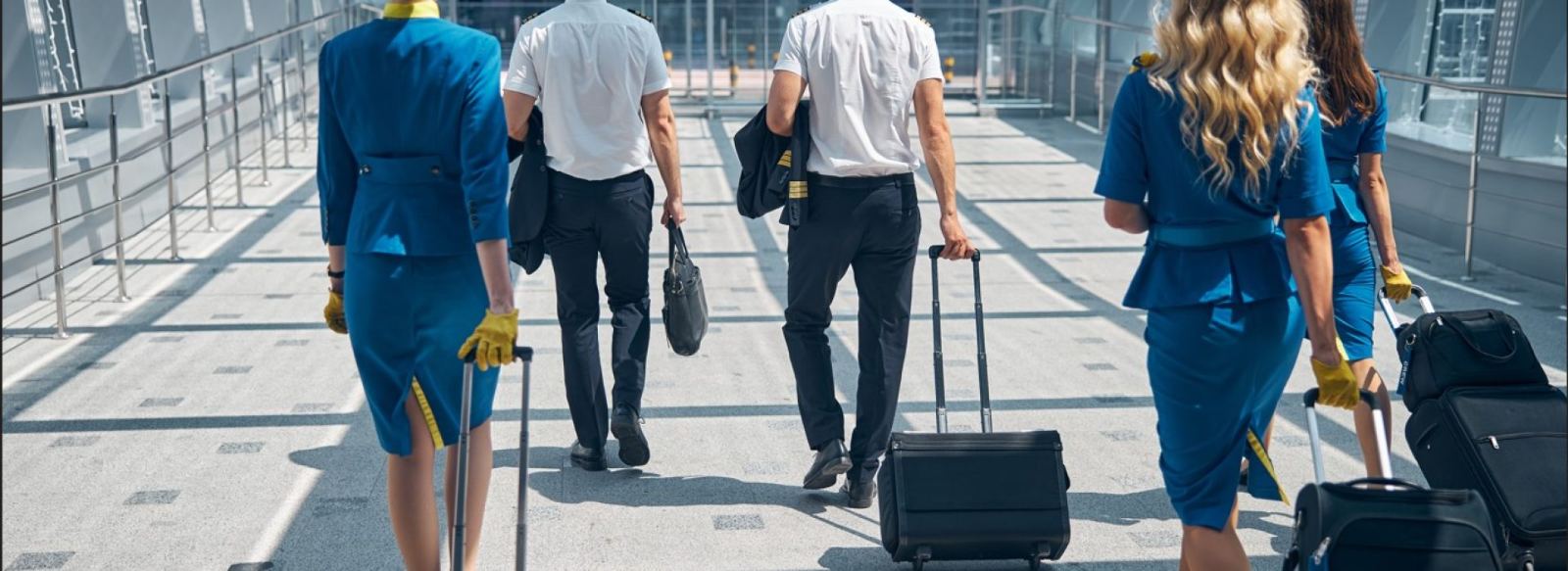 Flight crew traveling with luggage for MN Black Car charter service