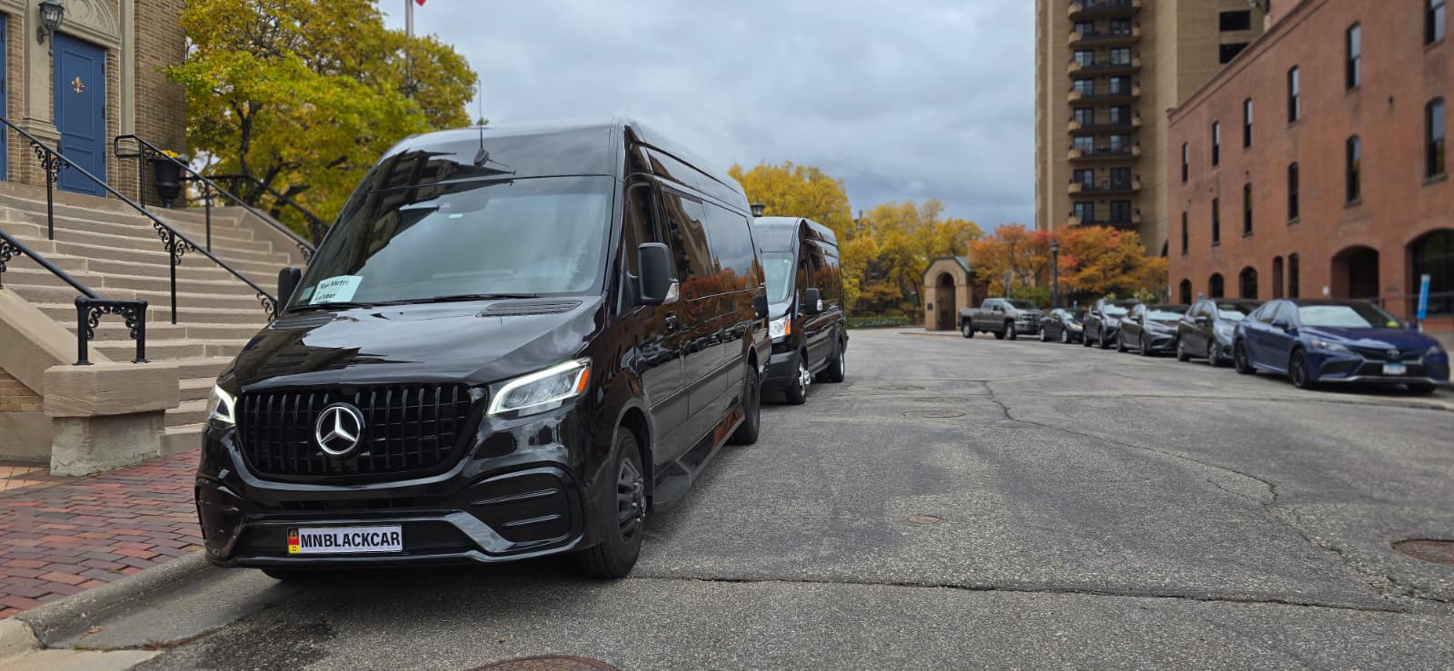 MN Black Car point to point transportation vehicle, view 1